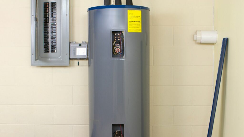 An electric hot water heater installed in a utility room, providing energy-efficient water heating.